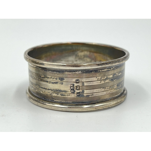 2260 - Five items to include hallmarked Birmingham silver napkin ring, two white metal compact mirrors etc.