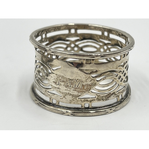 2265 - Five silver and white metal items to include two hallmarked Birmingham silver napkin rings, hallmark... 