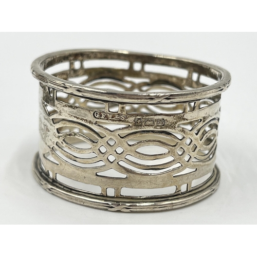 2265 - Five silver and white metal items to include two hallmarked Birmingham silver napkin rings, hallmark... 