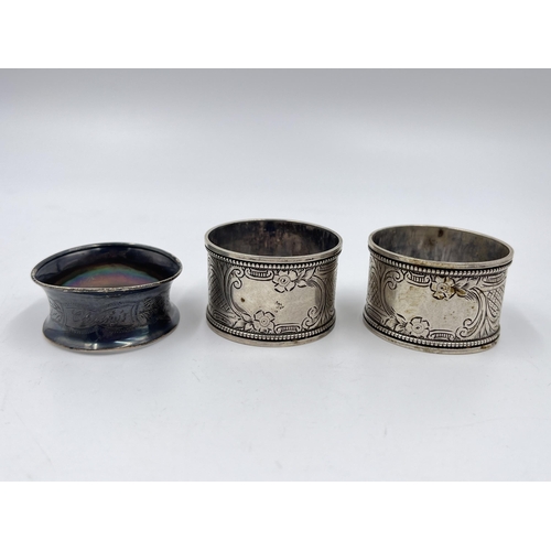 2275 - Three hallmarked sterling silver napkin rings, a pair of Birmingham dated 1908 and one Chester dated... 