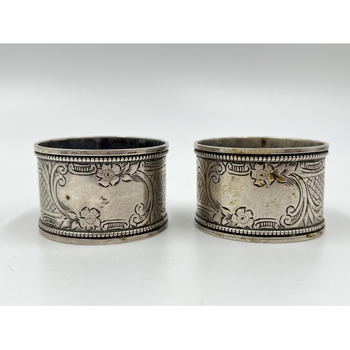 2275 - Three hallmarked sterling silver napkin rings, a pair of Birmingham dated 1908 and one Chester dated... 