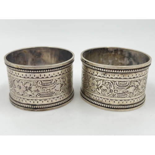 2275 - Three hallmarked sterling silver napkin rings, a pair of Birmingham dated 1908 and one Chester dated... 