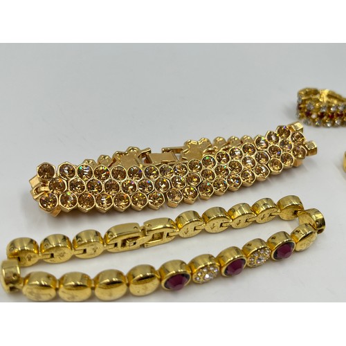 2191 - Eight gold tone bracelets to include tennis etc.