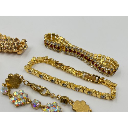 2191 - Eight gold tone bracelets to include tennis etc.