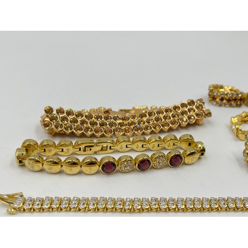 2191 - Eight gold tone bracelets to include tennis etc.