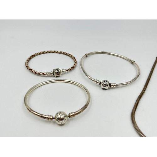 2187 - Four pieces of Pandora .925 silver jewellery, three bracelets and one necklace