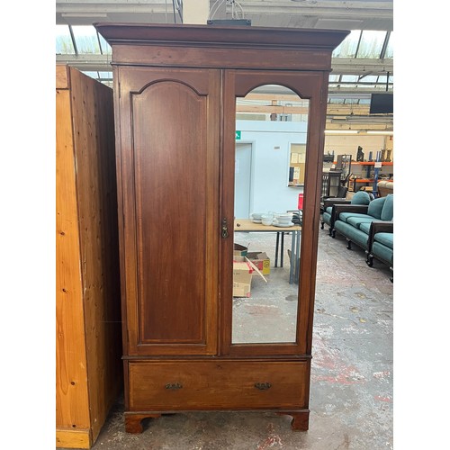 62A - An Edwardian inlaid mahogany double wardrobe with mirrored door and lower drawer - approx. 204cm hig... 