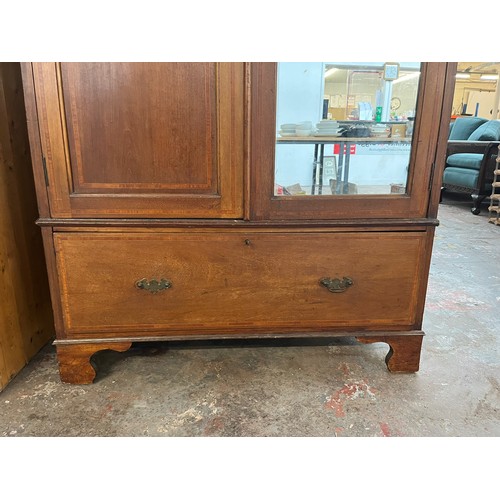 62A - An Edwardian inlaid mahogany double wardrobe with mirrored door and lower drawer - approx. 204cm hig... 