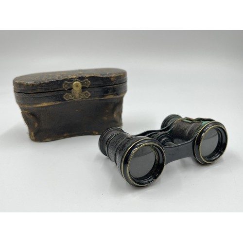 2365 - Three antique leather cased items, Negretti & Zambra Opticians London opera glasses, smoking pipe wi... 