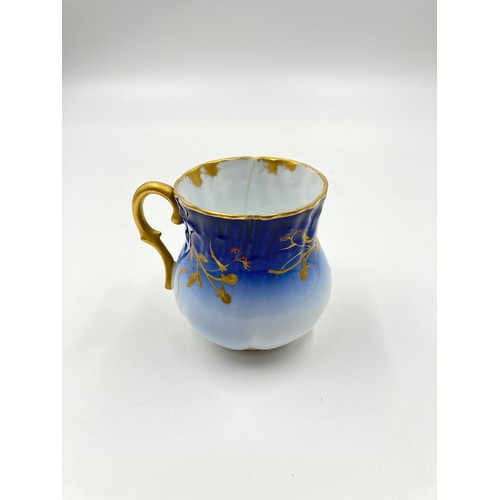 348 - A D & C France Limoges blue and gold porcelain ten piece coffee set