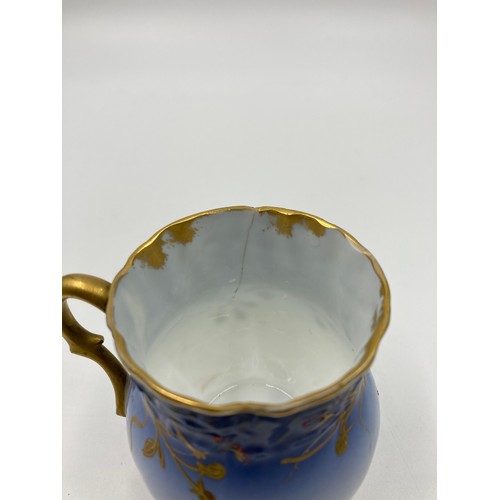 348 - A D & C France Limoges blue and gold porcelain ten piece coffee set