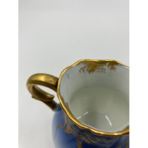 348 - A D & C France Limoges blue and gold porcelain ten piece coffee set