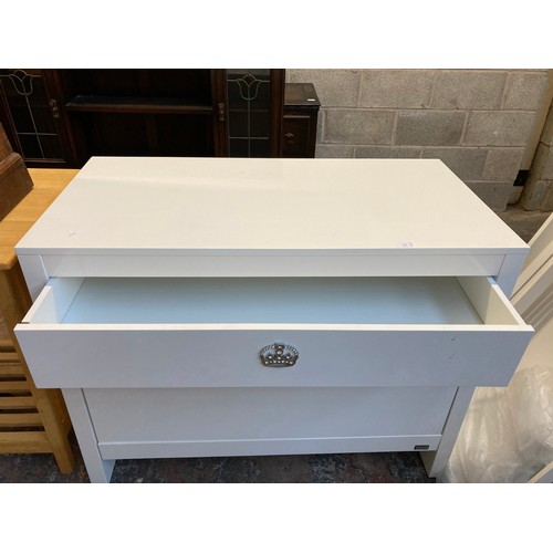 194 - A Tutsi Bambini white laminate chest of drawers and cot bed