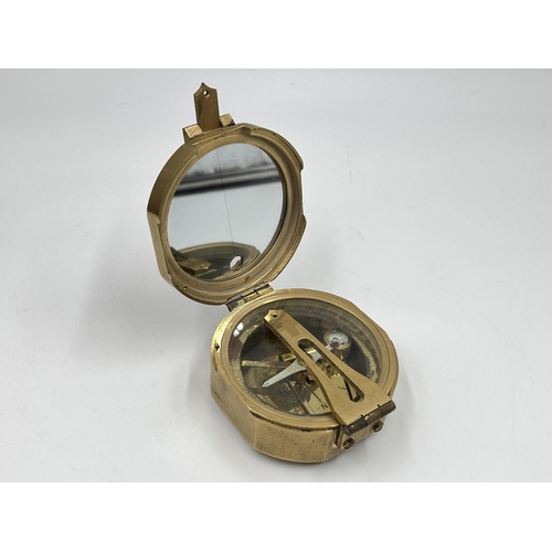 1259 - Three navigational instruments, one wood and brass cased Nauticalia Captain Cook brass focus magnifi... 