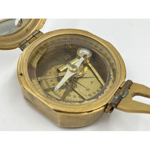 1259 - Three navigational instruments, one wood and brass cased Nauticalia Captain Cook brass focus magnifi... 