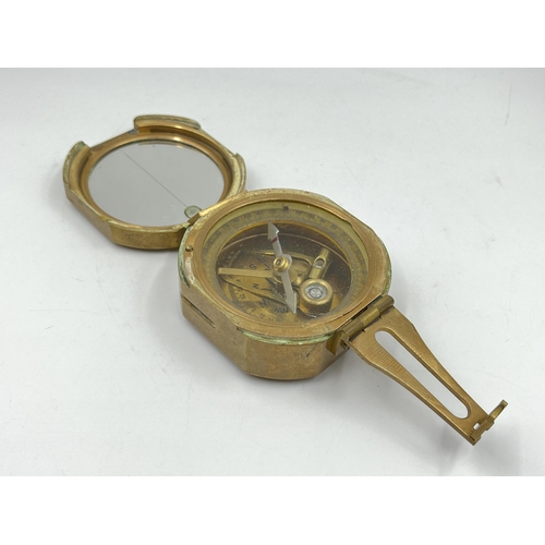 1259 - Three navigational instruments, one wood and brass cased Nauticalia Captain Cook brass focus magnifi... 