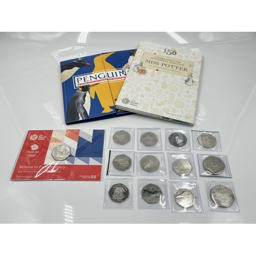 1268 - A collection of commemorative 50p coins to include Penguins etc.