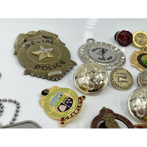 1269 - A collection of badges and buttons to include Royal Pioneer Corps Association, Special Police etc.