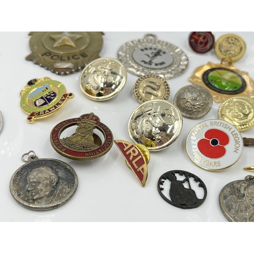 1269 - A collection of badges and buttons to include Royal Pioneer Corps Association, Special Police etc.