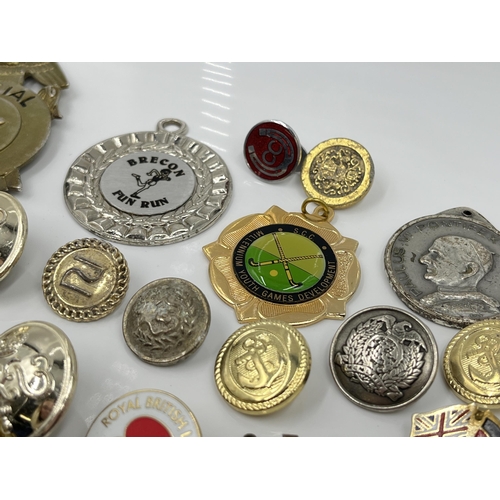 1269 - A collection of badges and buttons to include Royal Pioneer Corps Association, Special Police etc.