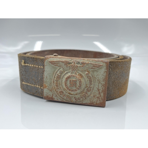 1275 - A WWII leather belt with German SS pressed metal buckle