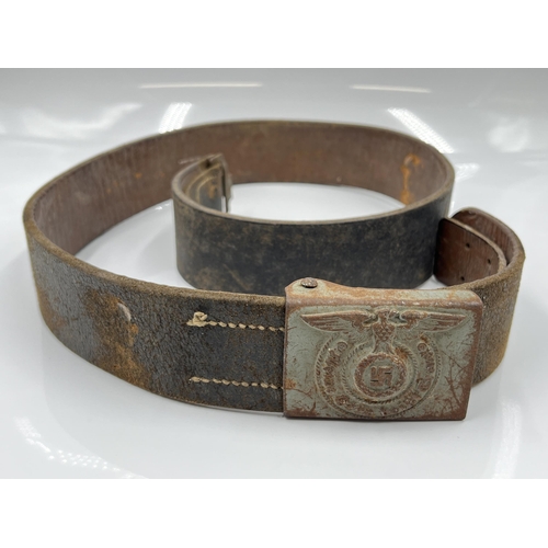 1275 - A WWII leather belt with German SS pressed metal buckle