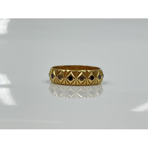 1126 - A hallmarked London 9ct gold garnet and clear gemstone textured eternity ring, dated 1979, size M½ -... 