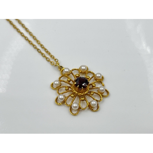 1128 - A yellow metal chain necklace with hallmarked London 9ct gold garnet and seed pearl pendant, dated 1... 