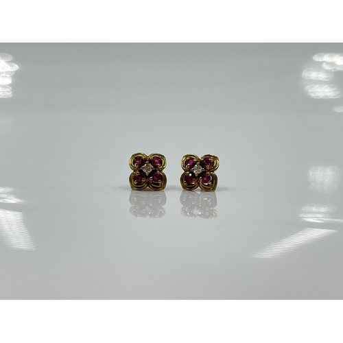 1125 - A pair of 9ct gold ruby and diamond earrings - approx. gross weight 1.09 grams