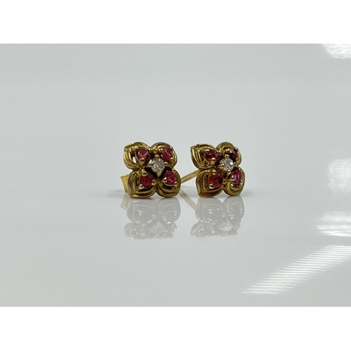 1125 - A pair of 9ct gold ruby and diamond earrings - approx. gross weight 1.09 grams