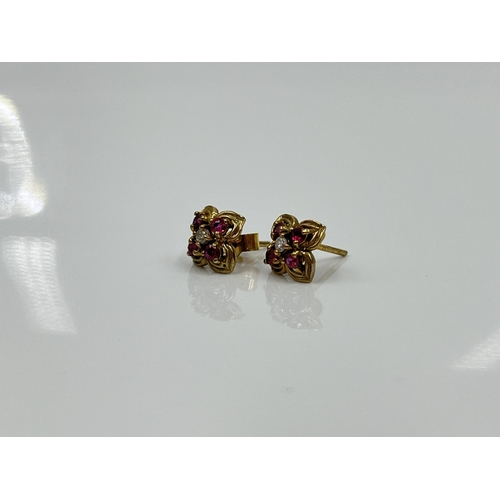 1125 - A pair of 9ct gold ruby and diamond earrings - approx. gross weight 1.09 grams