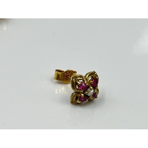 1125 - A pair of 9ct gold ruby and diamond earrings - approx. gross weight 1.09 grams