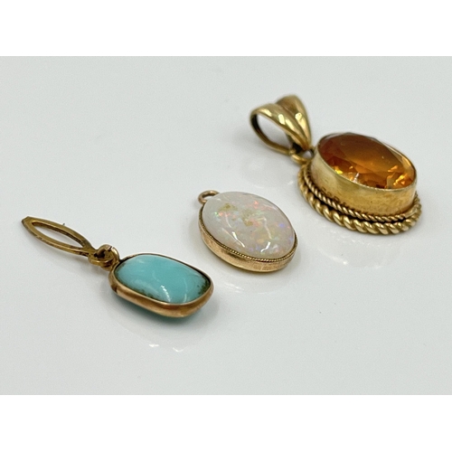 1121 - Three gemstone pendants, one 9ct gold citrine, one yellow metal opal and one yellow metal turquoise ... 