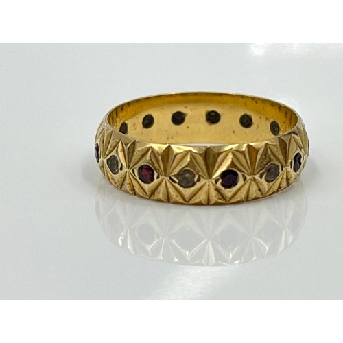 1126 - A hallmarked London 9ct gold garnet and clear gemstone textured eternity ring, dated 1979, size M½ -... 