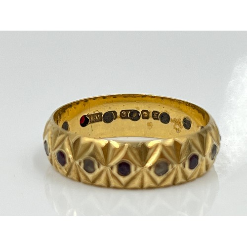 1126 - A hallmarked London 9ct gold garnet and clear gemstone textured eternity ring, dated 1979, size M½ -... 