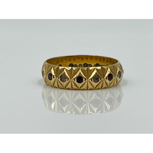 1126 - A hallmarked London 9ct gold garnet and clear gemstone textured eternity ring, dated 1979, size M½ -... 