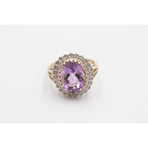 1001 - A 9ct gold amethyst and diamond halo ring, size S - approx. gross weight 5 grams