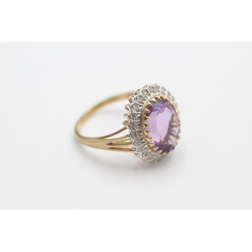 1001 - A 9ct gold amethyst and diamond halo ring, size S - approx. gross weight 5 grams