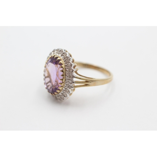 1001 - A 9ct gold amethyst and diamond halo ring, size S - approx. gross weight 5 grams