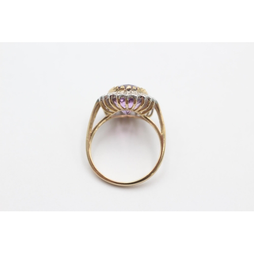 1001 - A 9ct gold amethyst and diamond halo ring, size S - approx. gross weight 5 grams