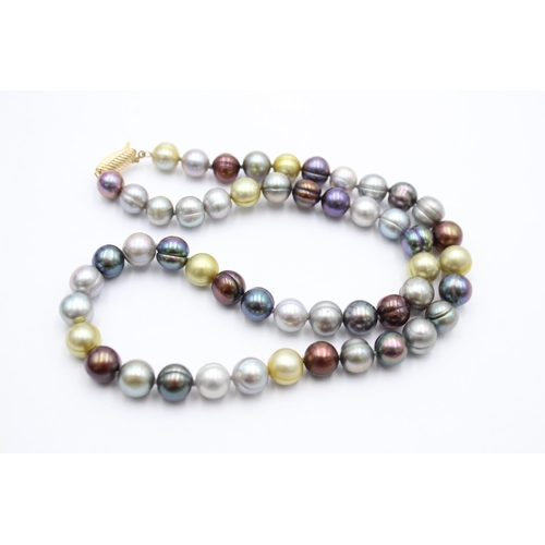 1003 - A multi-coloured pearl necklace with 14ct gold clasp - approx. gross weight 46.6 grams