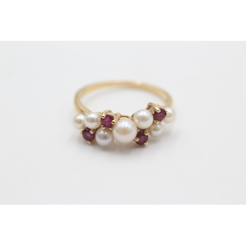 1011 - A 9ct gold pearl and ruby cluster ring, size N½ - approx. gross weight 2.7 grams