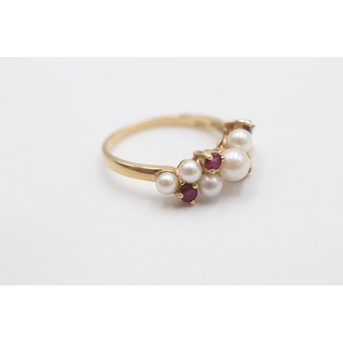 1011 - A 9ct gold pearl and ruby cluster ring, size N½ - approx. gross weight 2.7 grams