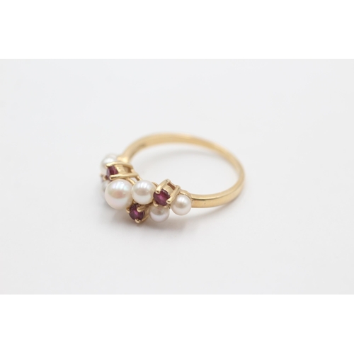 1011 - A 9ct gold pearl and ruby cluster ring, size N½ - approx. gross weight 2.7 grams