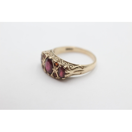 1012 - A 9ct gold garnet gypsy ring, size N½ - approx. gross weight 3.5 grams