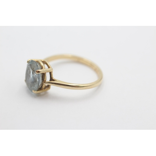 1020 - A 9ct gold topaz solitaire ring, size O - approx. gross weight 2.7 grams