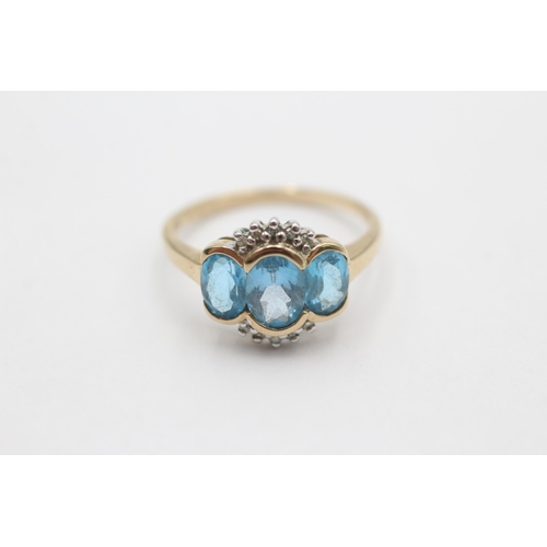 1024 - A 9ct gold diamond and topaz dress ring, size O½ - approx. gross weight 2.5 grams