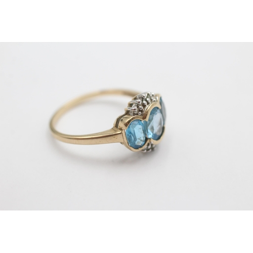 1024 - A 9ct gold diamond and topaz dress ring, size O½ - approx. gross weight 2.5 grams