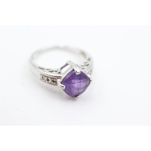 1030 - A 9ct white gold amethyst and diamond dress ring, size N½ - approx. gross weight 3.7 grams