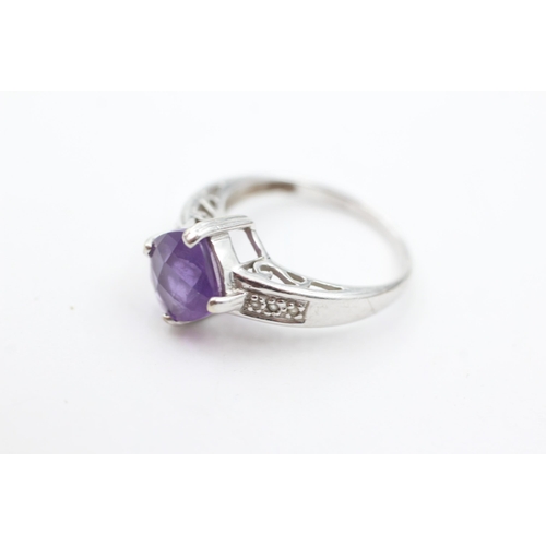 1030 - A 9ct white gold amethyst and diamond dress ring, size N½ - approx. gross weight 3.7 grams